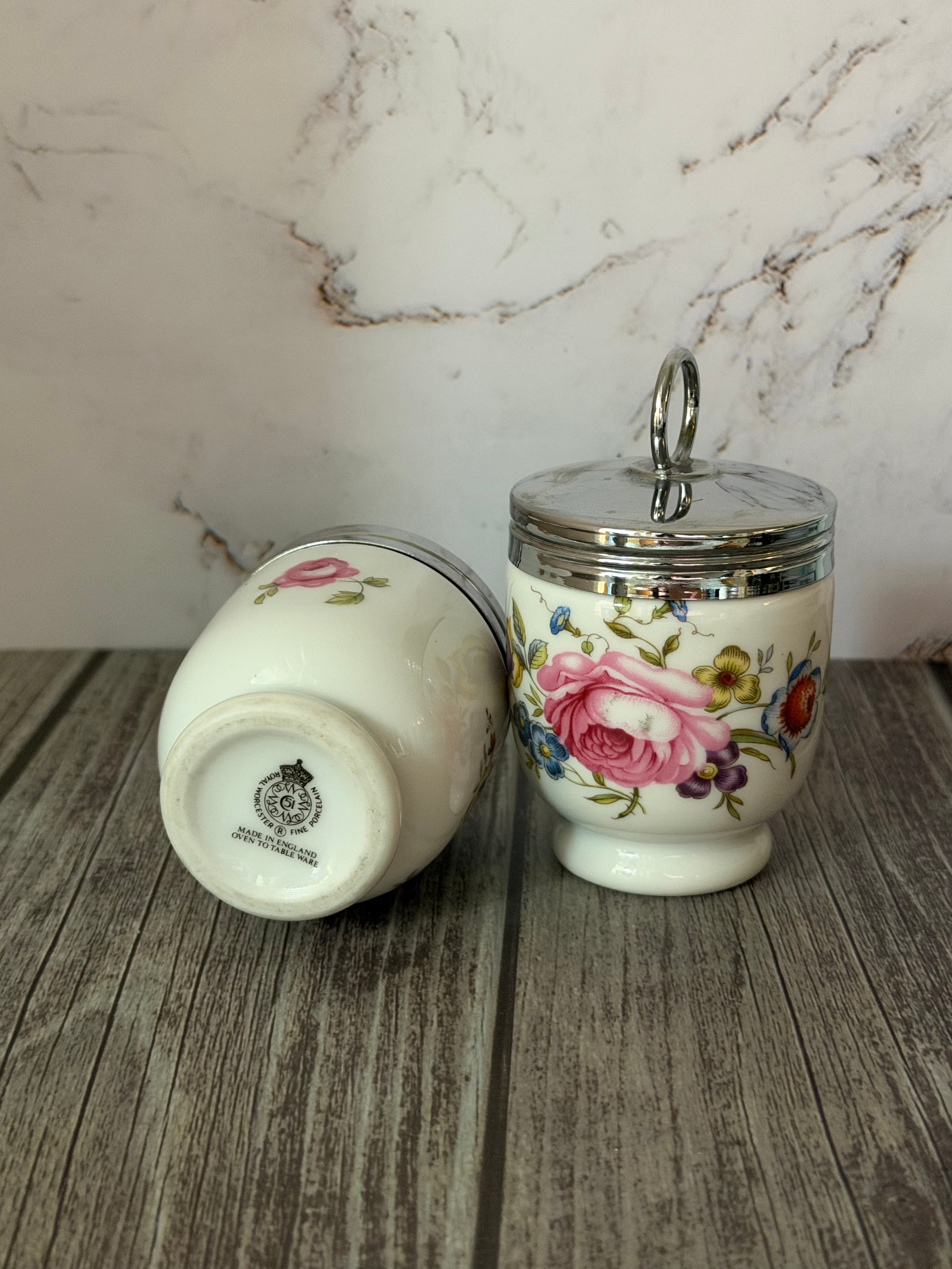 Decorative ceramic jar with floral design on a wooden surface with marble background